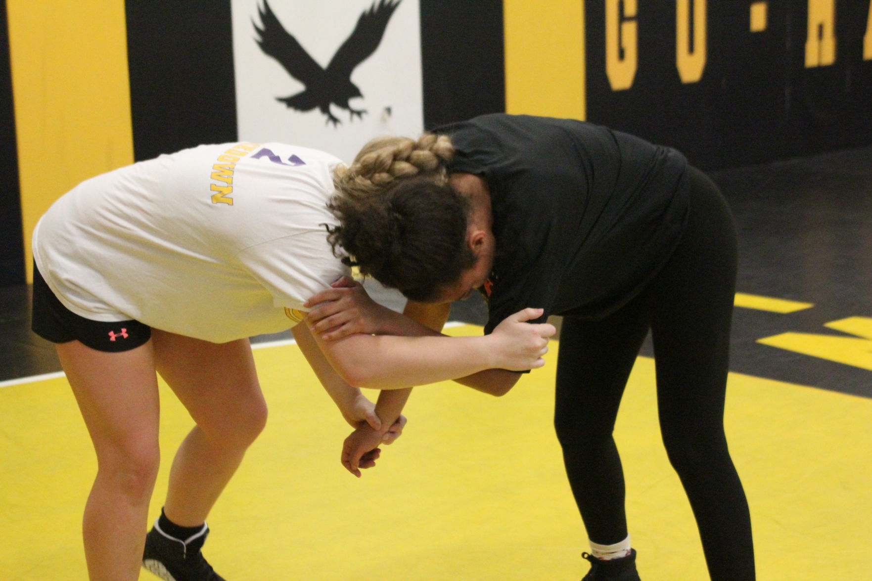 Two girls wrestlers practice